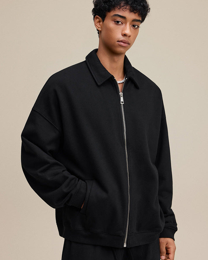 Black polo zip up, three-quarter pose, relaxed fit