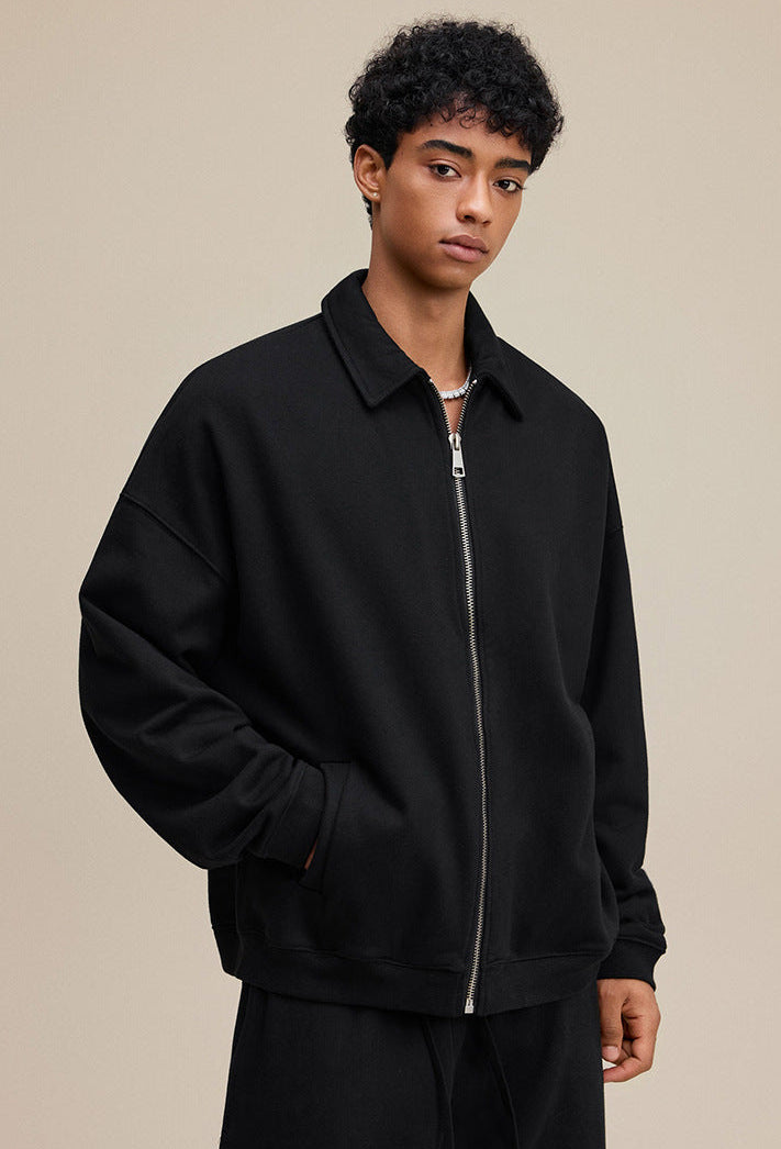 Black polo zip up, three-quarter pose, relaxed fit