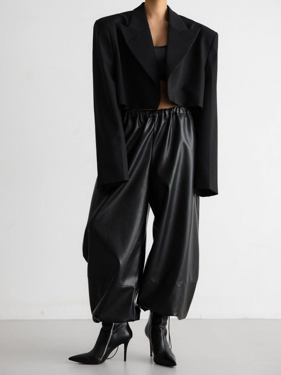 Black PU leather women’s pants styled with cropped blazer