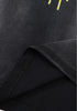 Folded hem showing fabric weight and texture on black tank