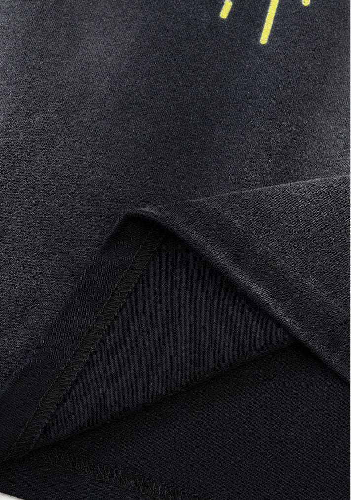 Folded hem showing fabric weight and texture on black tank