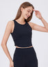 Black sleeveless workout tank with ruched sides for yoga and gym