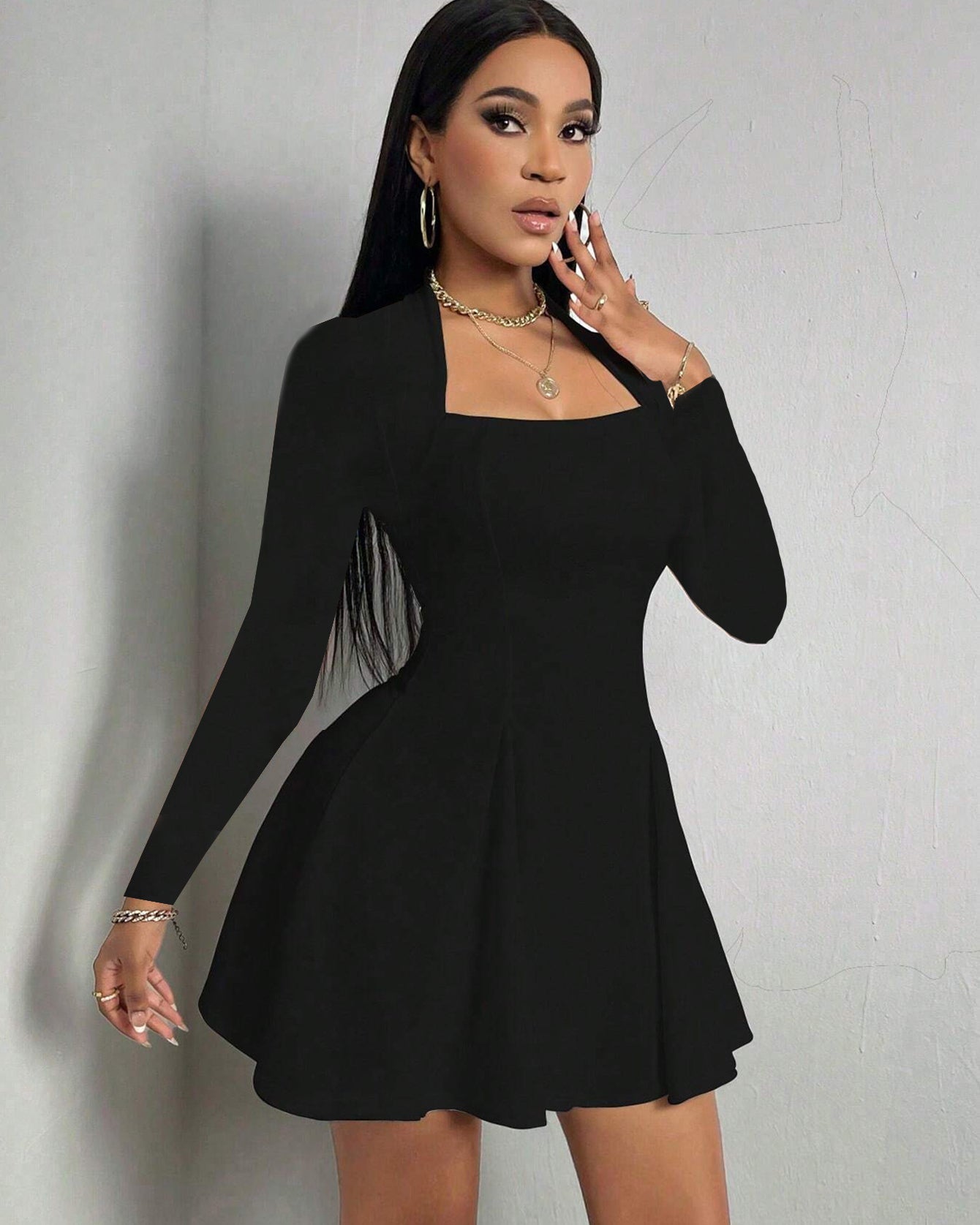 Black square-neck long sleeve mini dress with fitted top and flared A-line skirt in front view.