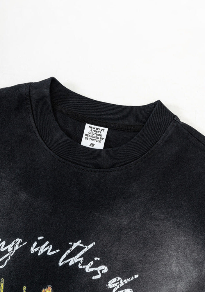 Close-up of ribbed neckline and printed label inside black tank
