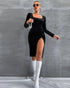 Black velvet bodycon dress with long sleeves, square neckline, and high side slit shown in full-body walking pose