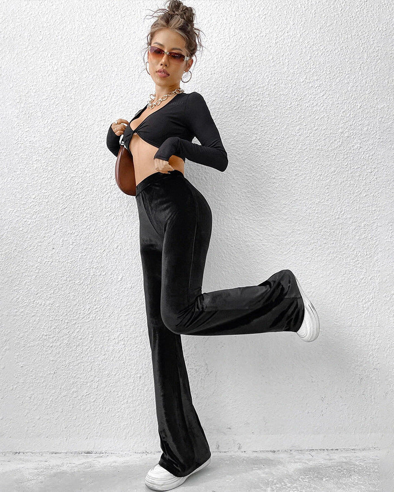 black velvet flare pants full body casual pose
