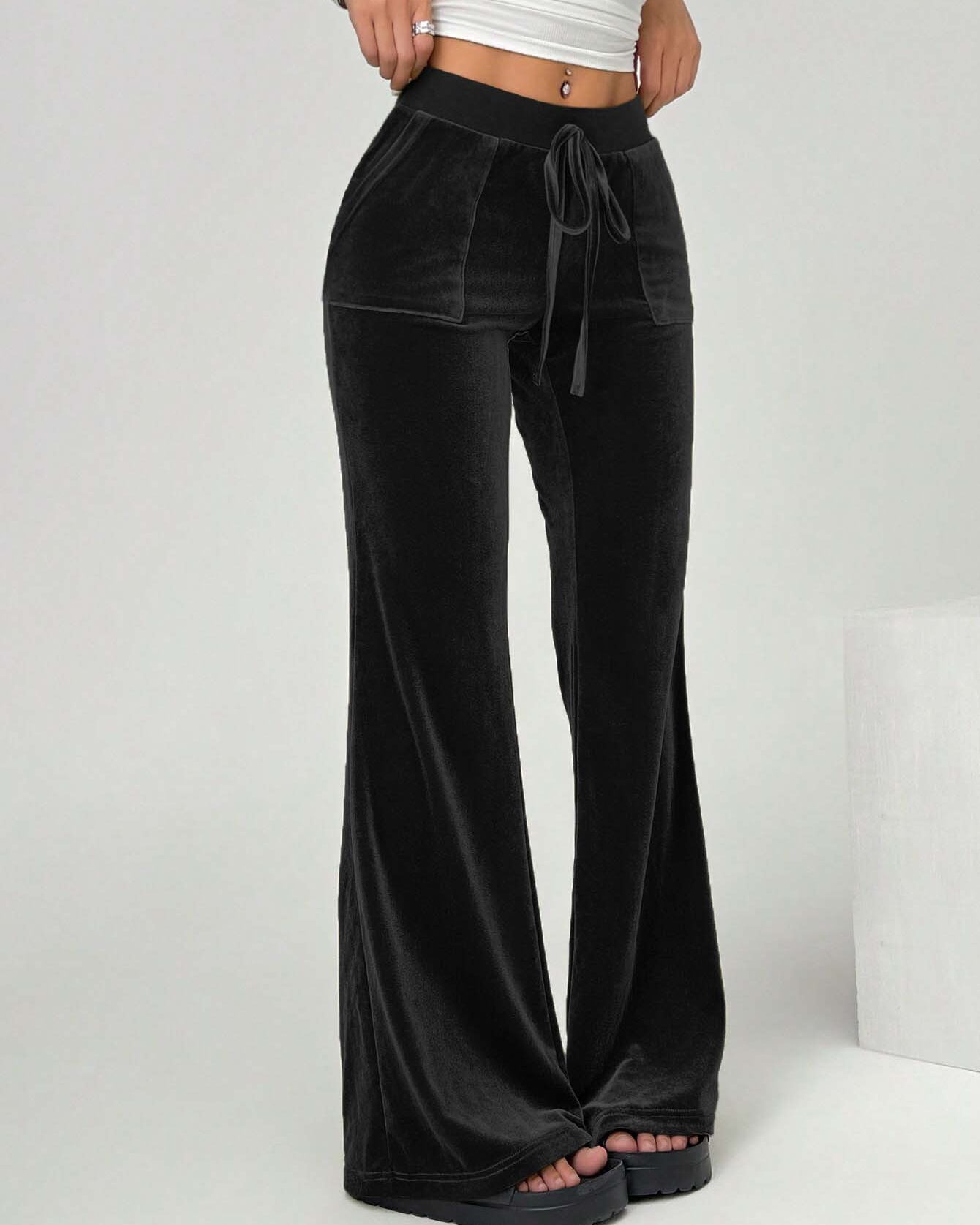 black velvet yoga flare pants front angled view
