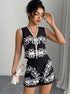 Woman wearing black and white two piece short set with floral print