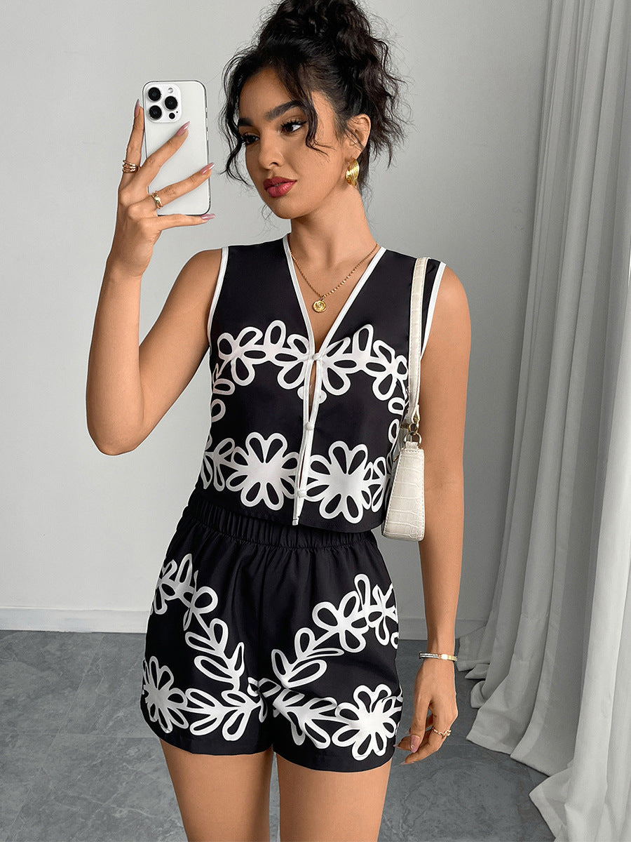 Model posing in black and white vacation two piece