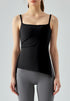 Woman in black yoga tank top paired with gray leggings, front view.