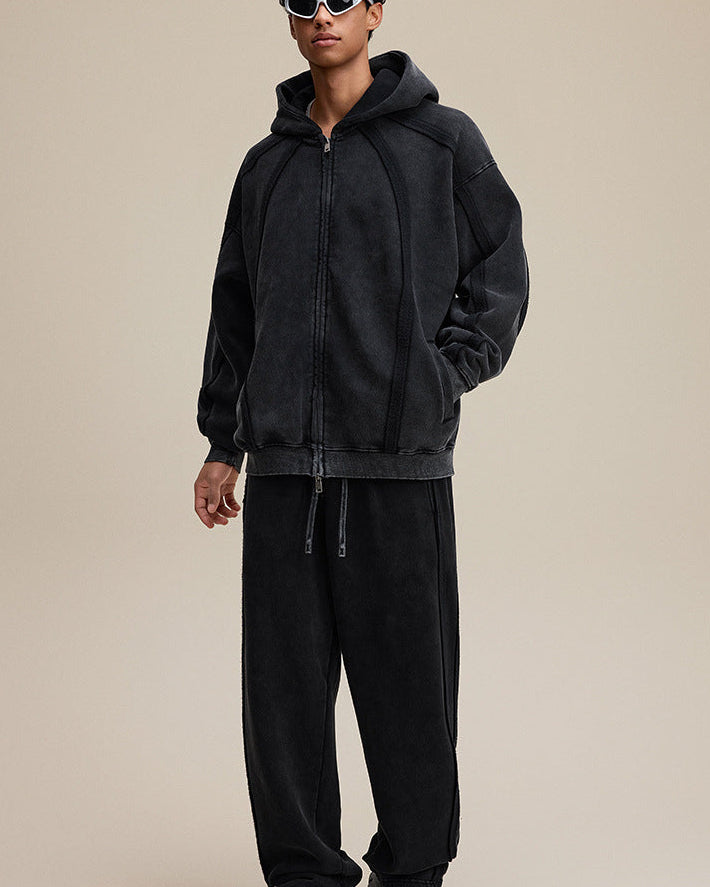Model full outfit in black zip hoodie and pants, oversized fit
