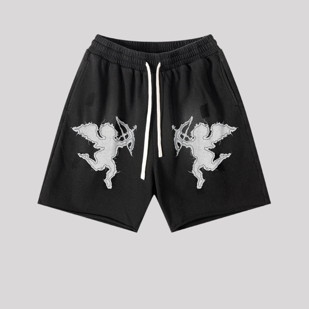 Black cotton shorts featuring white embroidered cupid angels and drawstring waist on light gray background
