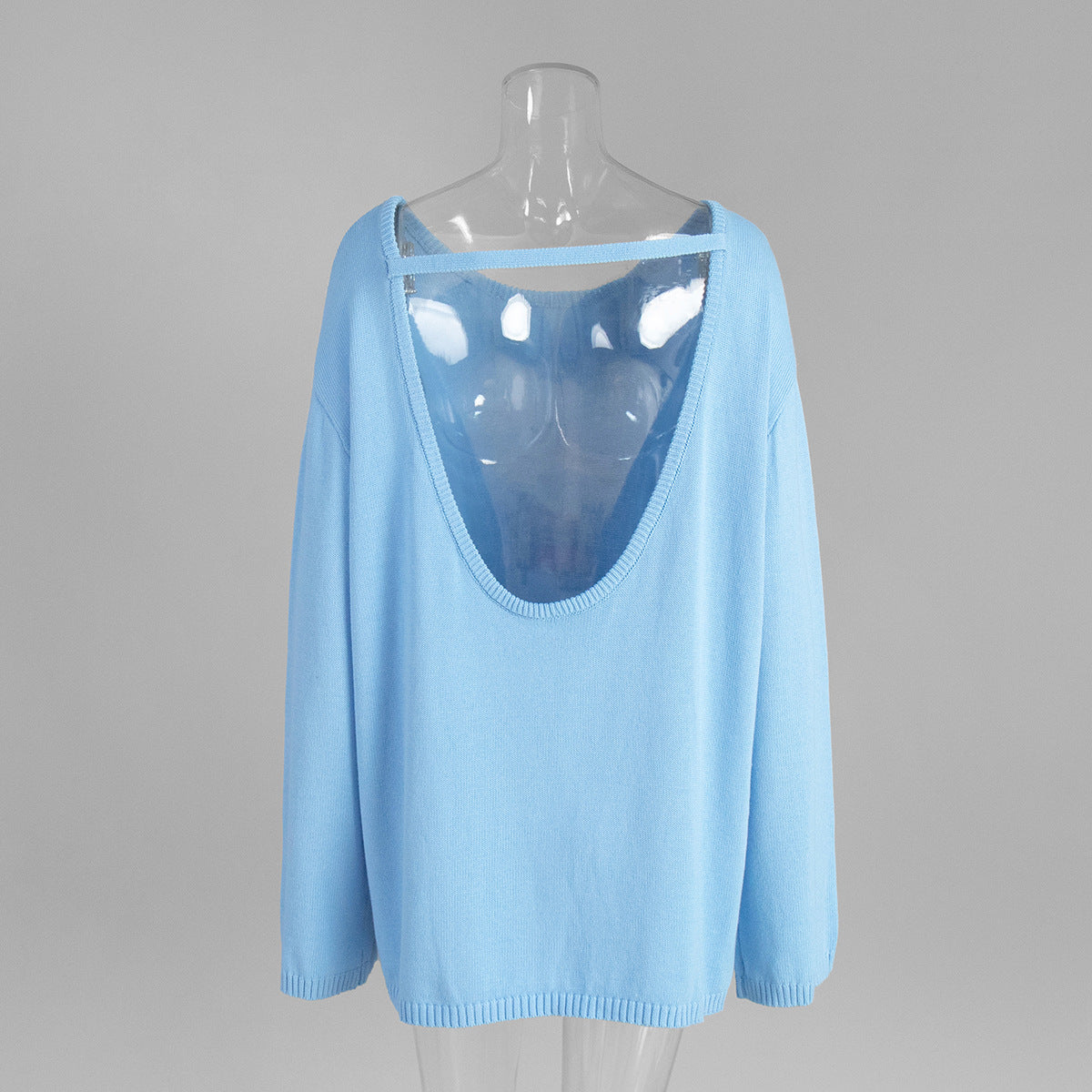Back view of light blue backless knit sweater with open scoop back