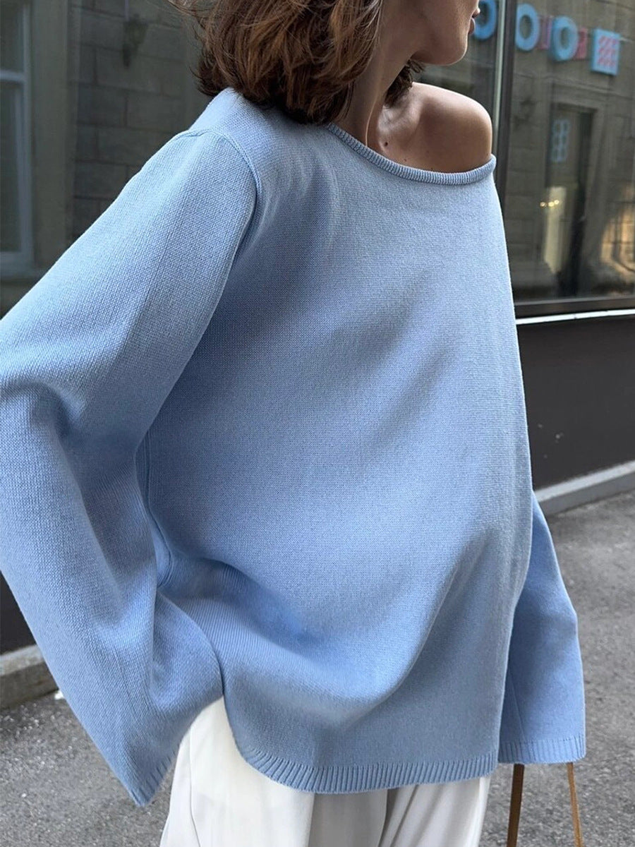 Woman wearing light blue knit sweater with relaxed fit