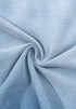 Blue gradient tee fabric twisted to showcase soft stretch and texture.