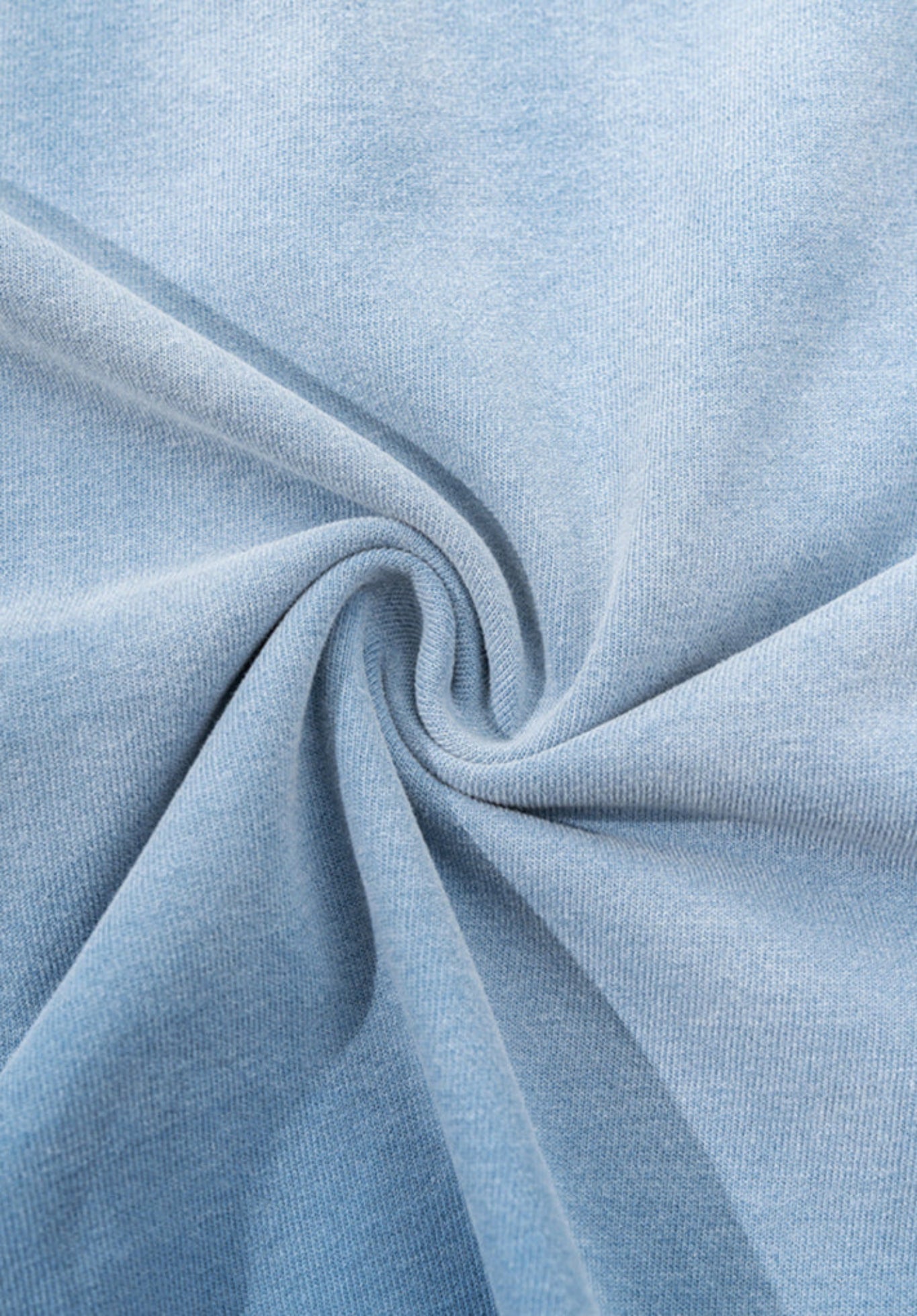 Blue gradient tee fabric twisted to showcase soft stretch and texture.