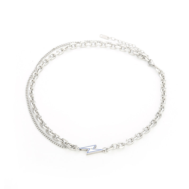  Dual-layer silver chain necklace with lightning bolt pendant on white background.