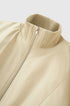 Beige bomber collar close-up, clean stitching and zipper guard