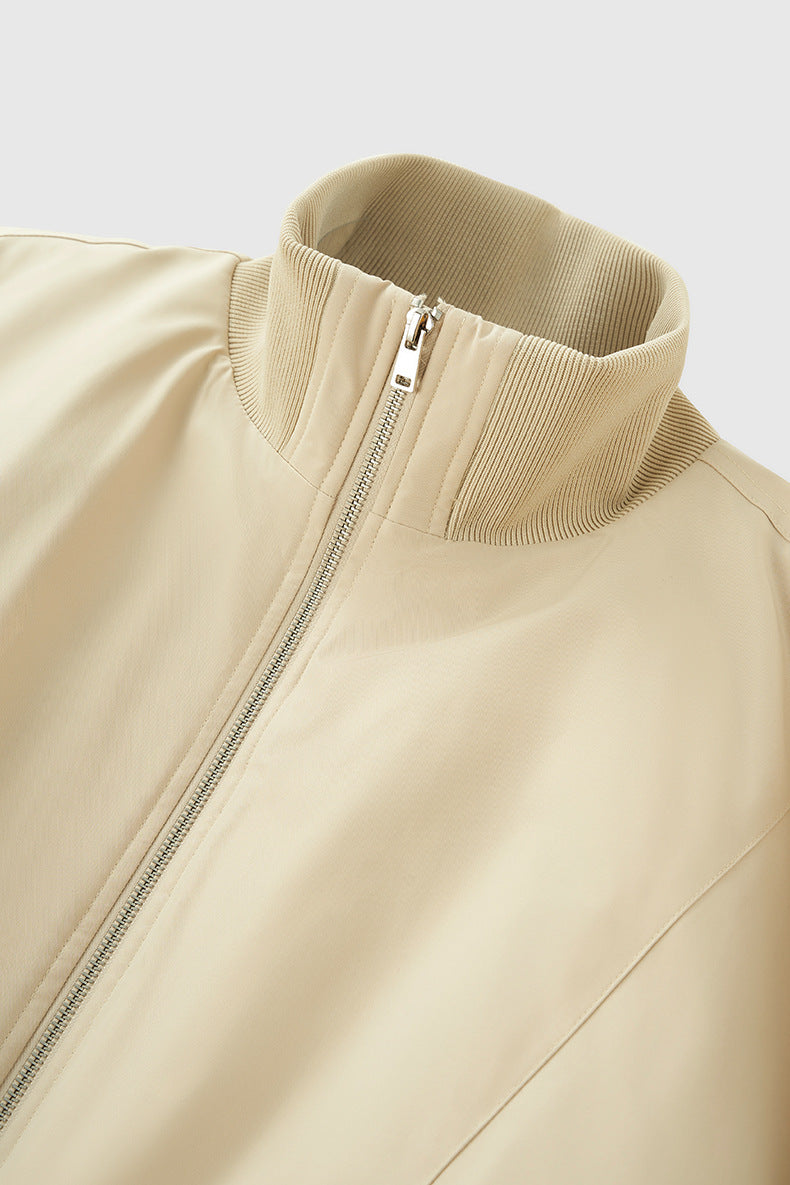 Beige bomber collar close-up, clean stitching and zipper guard