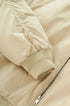 Beige bomber sleeve and rib cuff close-up, zip tape detail