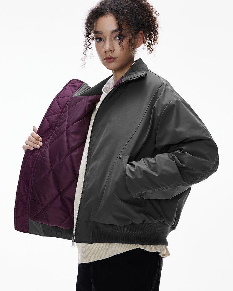 Gray bomber jacket, hands in pockets, clean street fit