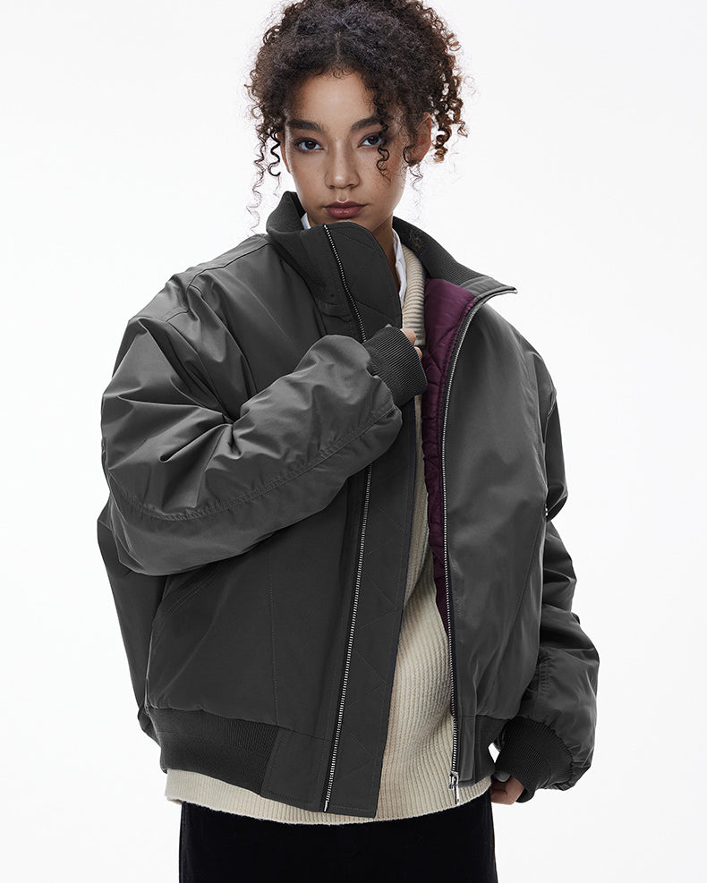 Close view—gray bomber stand collar and zipper, minimal top block
