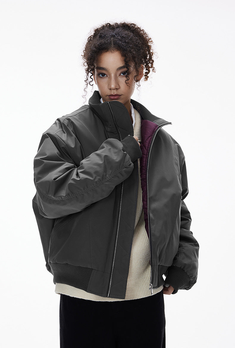 Close view—gray bomber stand collar and zipper, minimal top block