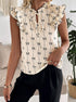 Women’s short sleeve bow print blouse with ruffle sleeves cream top front view