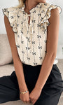 Bow print short sleeve blouse with ruffle sleeves women’s casual top sitting view