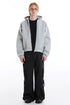Light gray boxy cropped zip-up hoodie styled open with wide black cargo pants