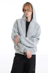 Close view of the light gray boxy hoodie with raglan seams and long sleeves