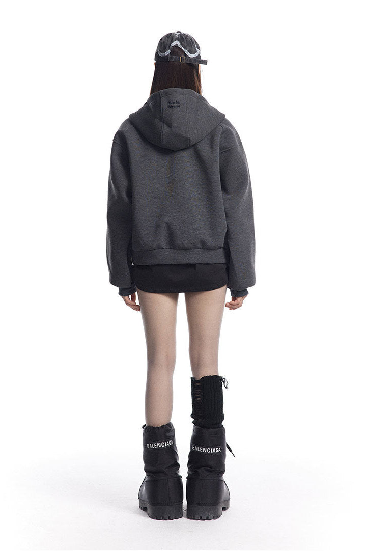 Back view of the charcoal boxy hoodie showing the hood and ribbed cropped hem