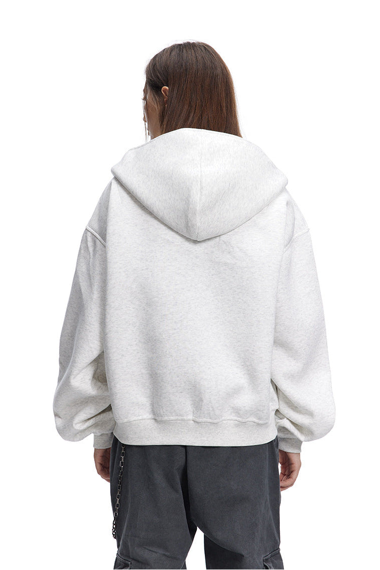 Rear view showing the hood and relaxed dropped shoulders of a heather grey boxy sweatshirt jacket.