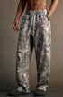 men branch camo polyester fleece sweatpants three-quarter side view with pocket detail
