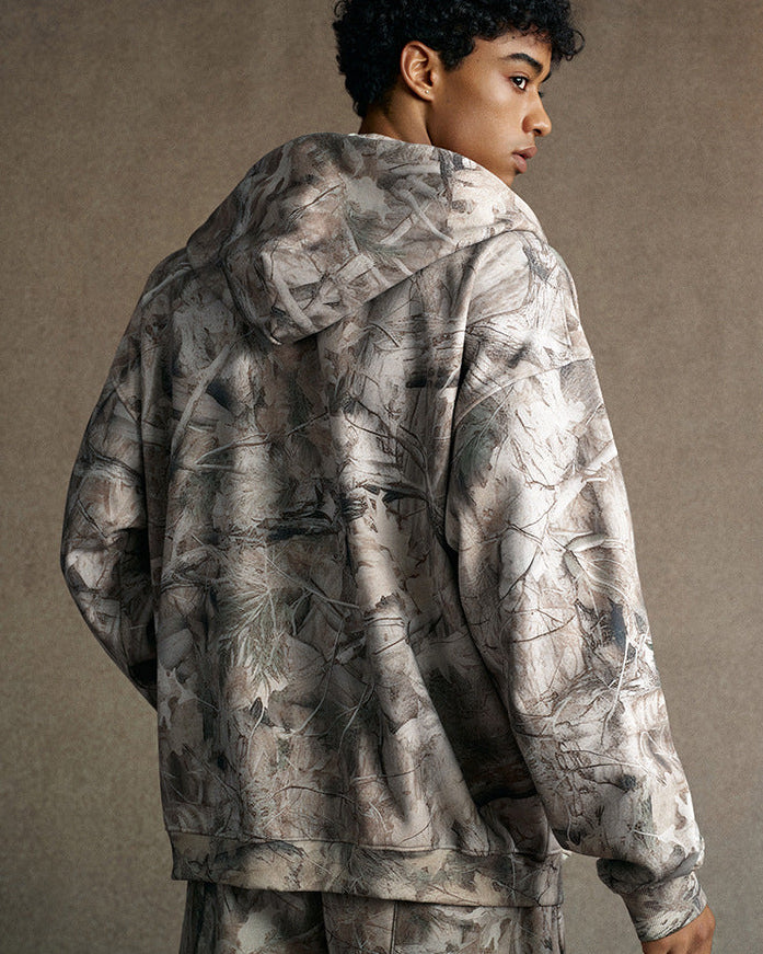 model back view in branch camo zip hoodie with jogger sweatpants