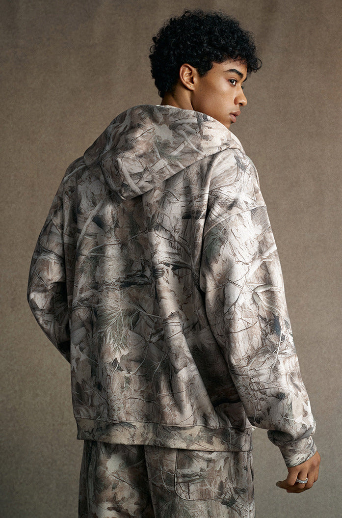model back view in branch camo zip hoodie with jogger sweatpants
