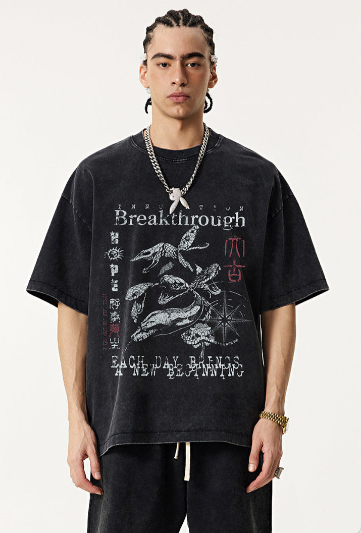 Model faces forward in "Breakthrough" tee with koi and bold text.