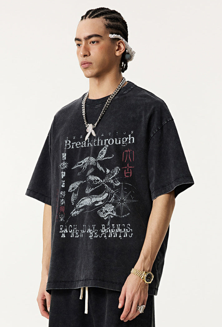 Rear view of vintage black "Breakthrough" tee worn by model.