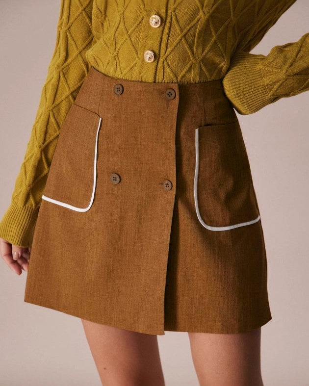 brown a-line skirt with white trim pockets front detail