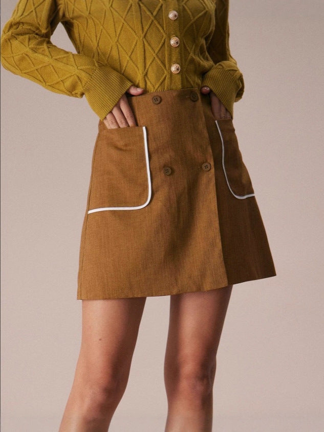 brown button mini skirt close-up with contrast pockets