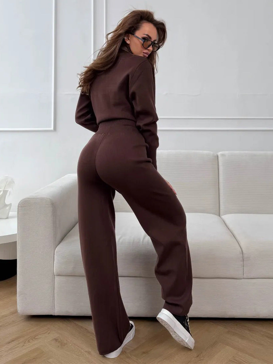 Back view of woman in brown 2 piece knit set with zip jacket and pants indoors