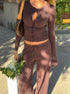 Close-up of brown knit cardigan with soft viscose fabric