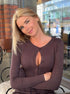 Brown viscose knit cardigan sweater worn outdoors