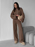 Woman wearing brown knit lounge set with zip jacket and pants