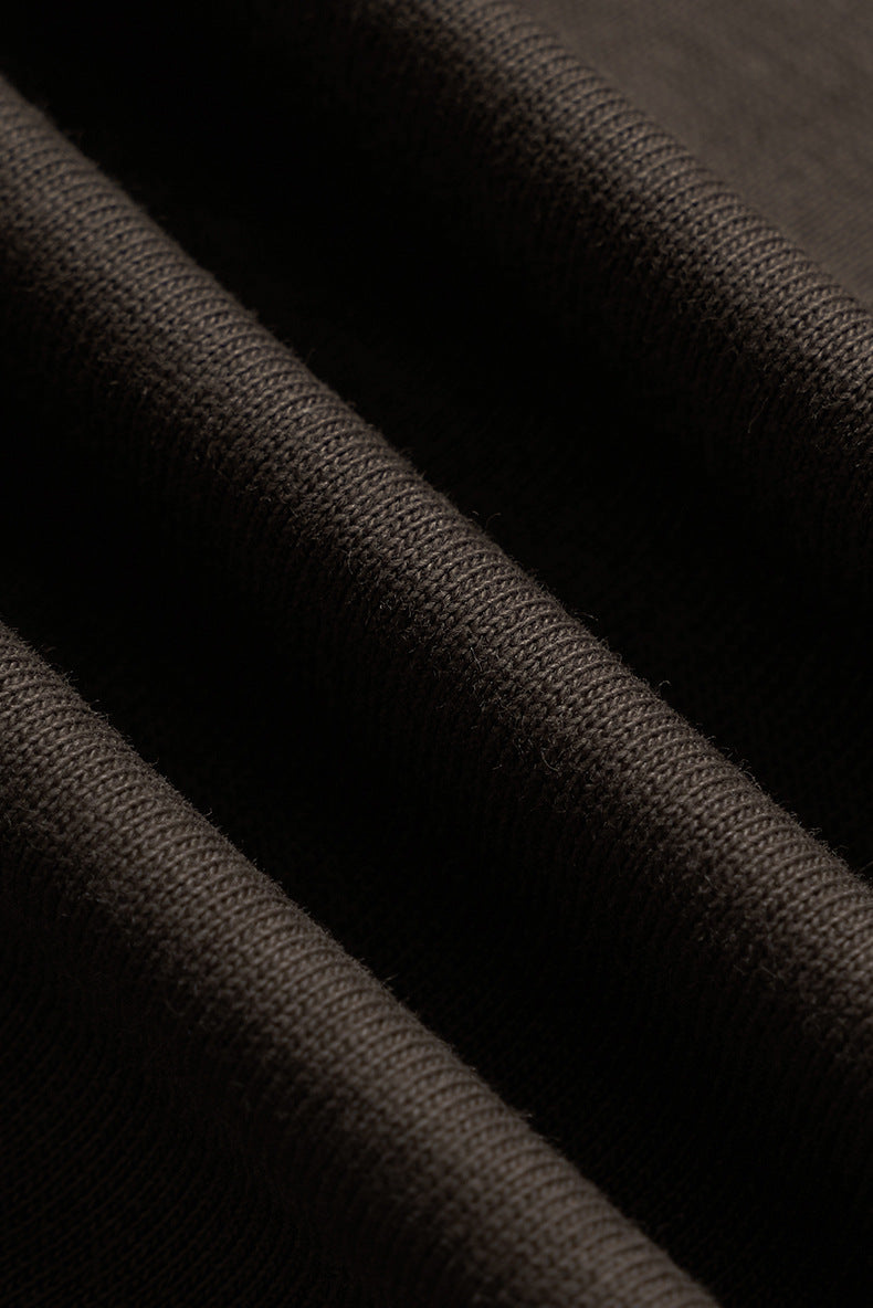 Close-up soft cotton fabric in dark brown long sleeve t-shirt