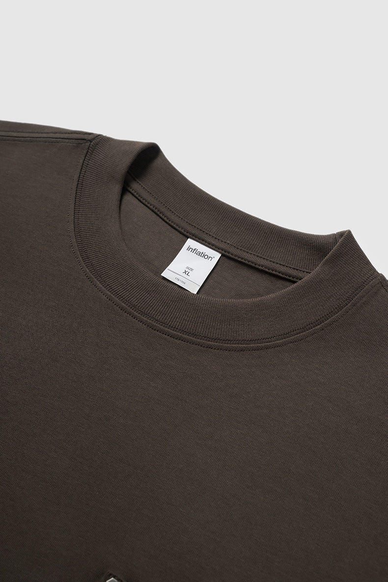 Dark brown oversized long sleeve pocket t-shirt close-up