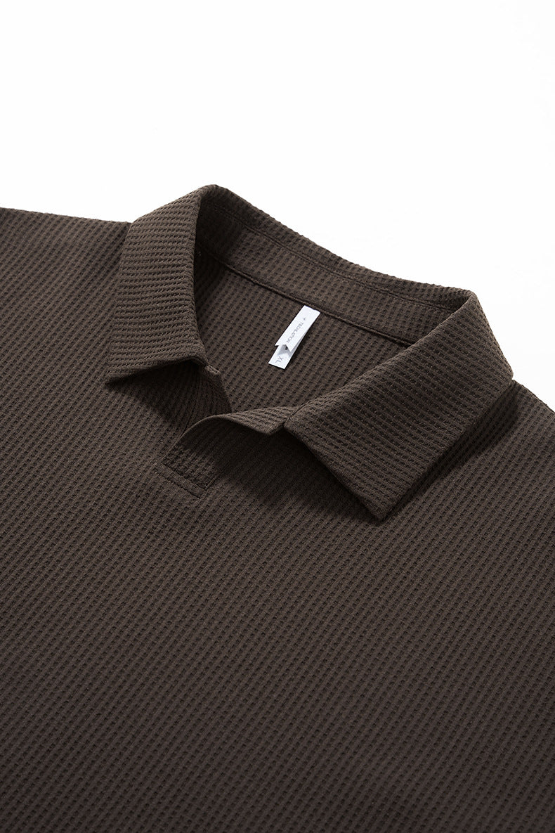 Close up of brown seagull collar long sleeve t shirt on a white background