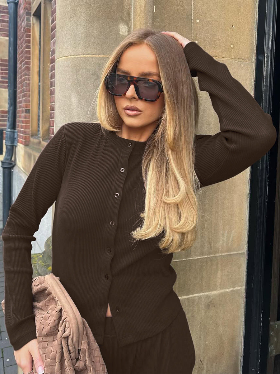 close-up of brown ribbed crop cardigan button and pocket detail