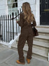 back view of brown ribbed co ord set worn by model outdoors