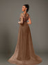 Back view of brown sequin mermaid dress featuring V back and sheer tulle overlay.